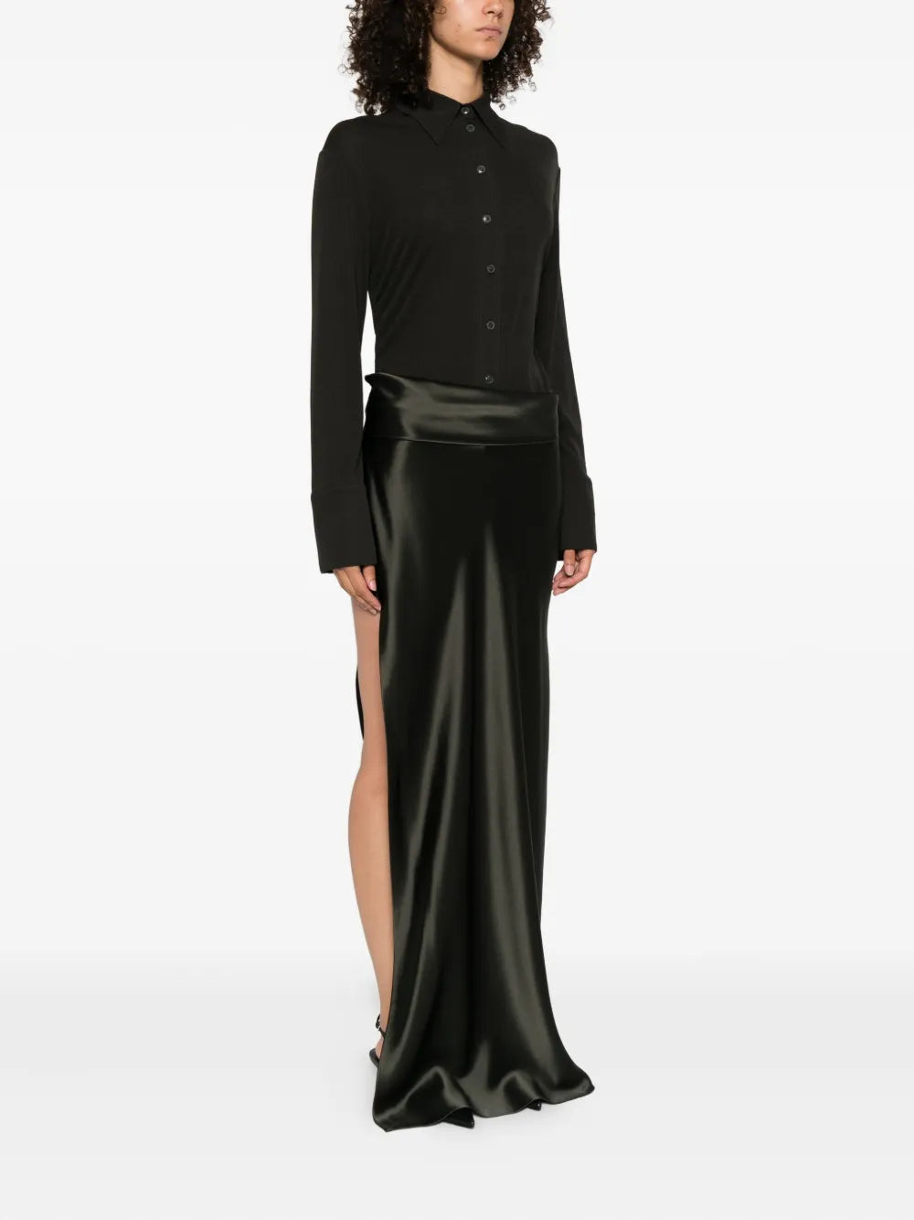 Close-up of the Scylla Dress in Dark Green highlighting the mesh jersey shirt and black slip satin skirt.
