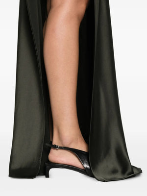 Back view of the Scylla Dress in Dark Green, featuring elegant draping and stylish silhouette.