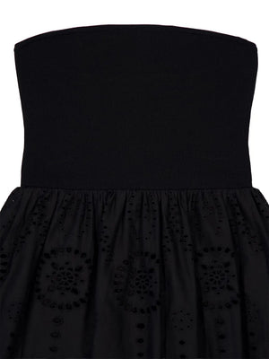 Elegant scalloped hem finish of the Strapless Knit and Broderie Dress in Black by Matteau.