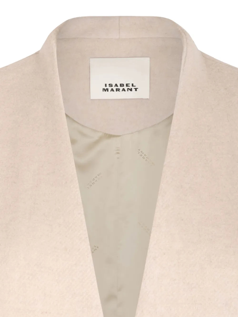 Dramatic angle of the Florane Coat in Ecru highlighting its modern silhouette and texture.