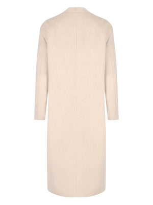 Close-up view of Florane Coat in Ecru showcasing its soft wool blend fabric and flap pockets.