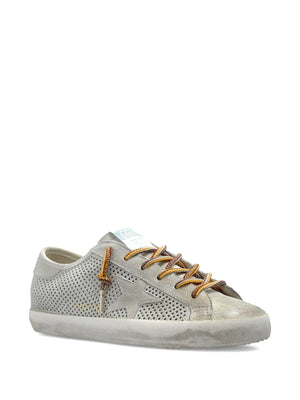 Close-up of the Grey Super Star sneakers showcasing the unique perforated suede design and multi-colored laces.