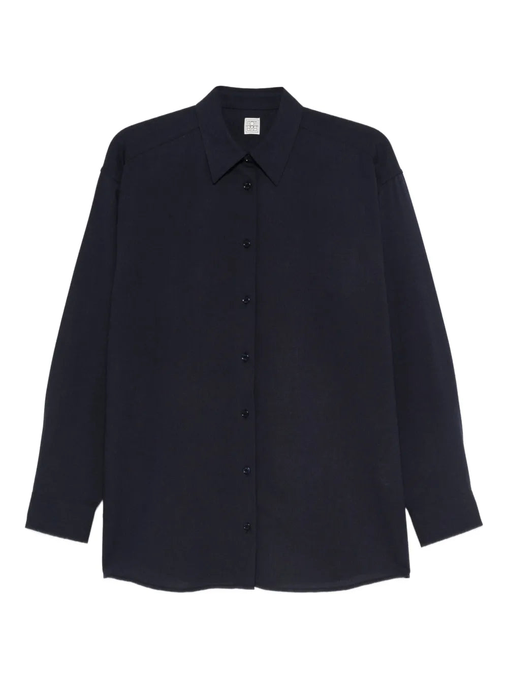 Fluid Classic Shirt in Navy by TOTEME showcasing an oversized silhouette with dropped shoulders.