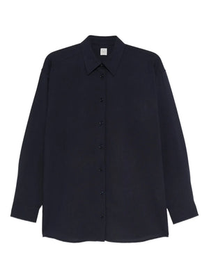 Fluid Classic Shirt in Navy by TOTEME showcasing an oversized silhouette with dropped shoulders.