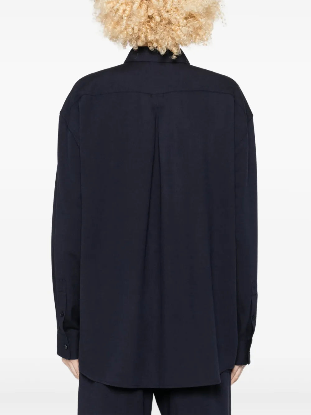 Back view of the Fluid Classic Shirt in Navy by TOTEME highlighting the longline design.