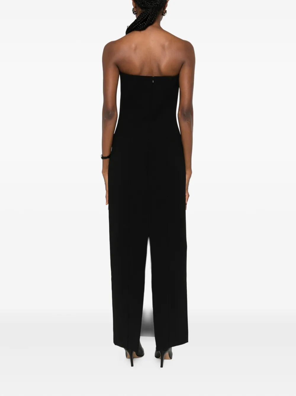 Close-up of the stylish strapless neckline on the Strapless Pocket Dress in Black by TOTEME.
