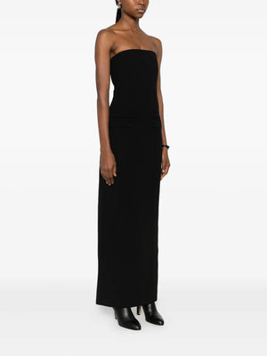The back zipper and slit detail of the Strapless Pocket Dress in Black by TOTEME, perfect for evening wear.
