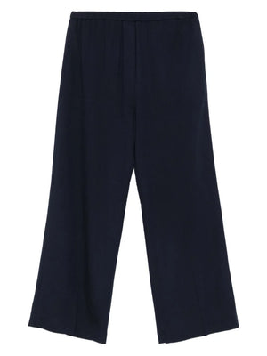 Fluid Winter Trousers in Navy by TOTEME, showcasing a lightweight canvas fabric with a touch of wool for warmth and style.