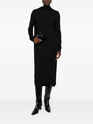 Close-up of the black Cocoon Cape Dress by TOTEME, highlighting the low-cut back and beautiful jersey fabric.