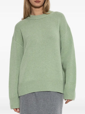 Renske Sweater in Seafoam worn casually emphasizing the extended ribbed hem and elongated sleeves.