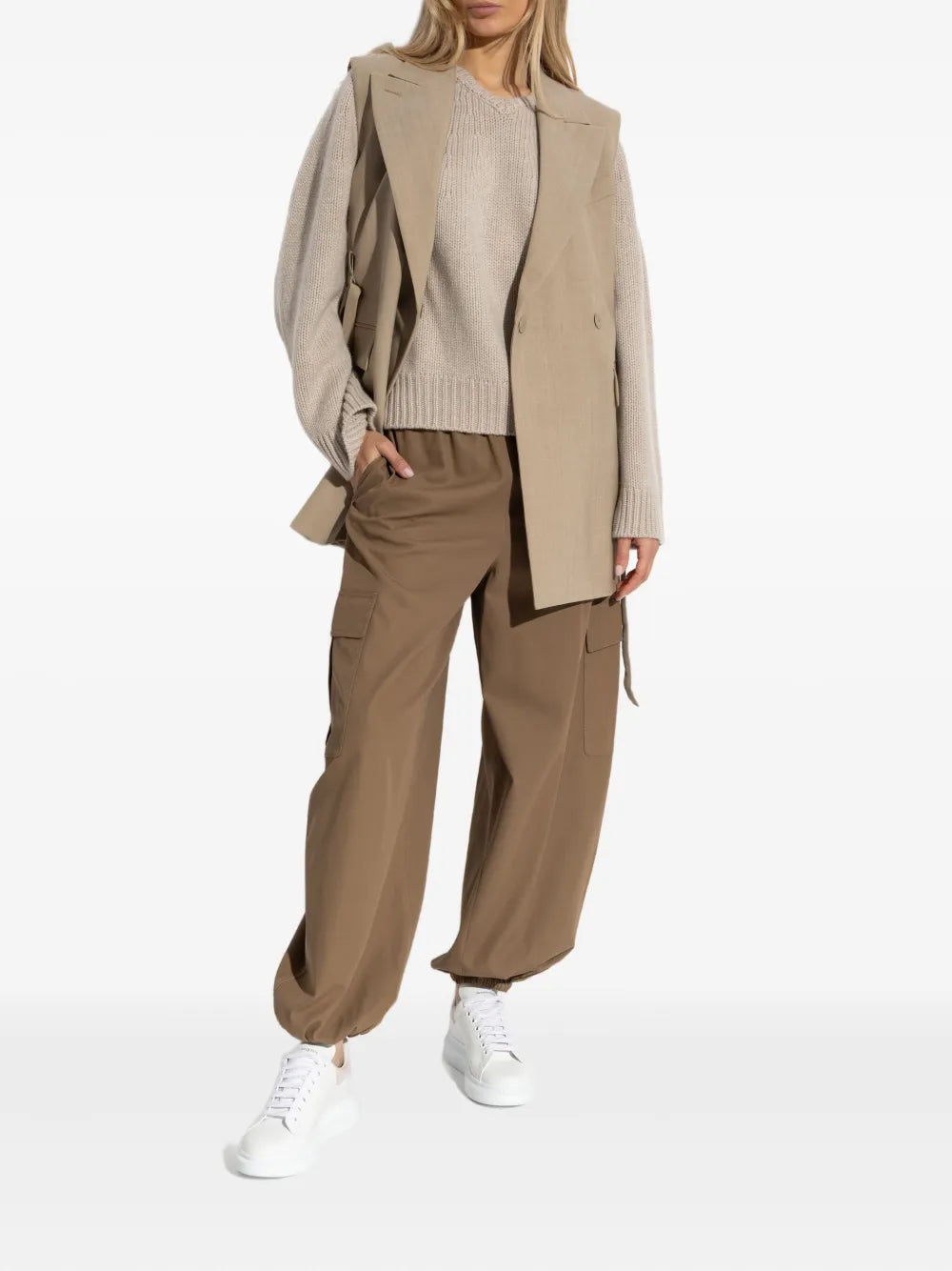 Close-up of Oia Sweater in Sand, showcasing the 3 gauge cashmere fabric and dropped raglan sleeves.