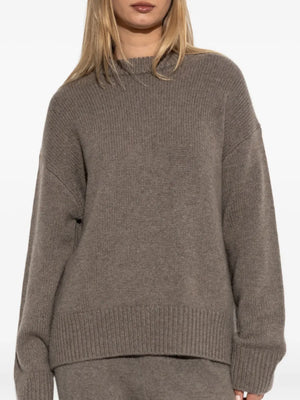 Elegant Renske Sweater in Truffle highlighting the dropped shoulders and elongated sleeves for a stylish look.