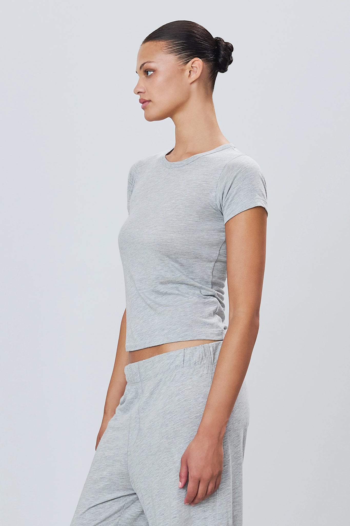 Close-up of Fitted Crewneck Short Sleeve T-shirt in Heather Grey, highlighting the slim fit and comfortable fabric of this fitted crewneck t-shirt.