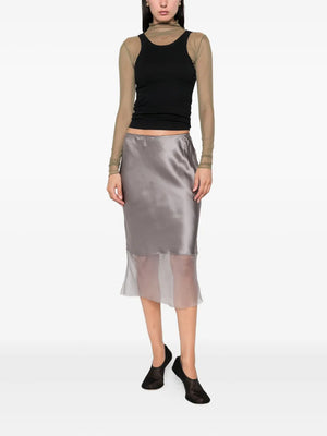 Stylish arrangement of the Catania Skirt in Smoke, showcasing its delicate silk fabric and elegant design.