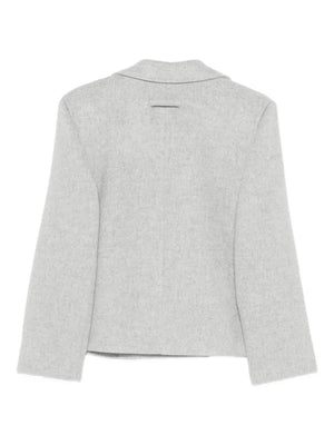 Close-up of the Nola Jacket in Grey by Proenza Schouler, featuring side welt pockets and a sophisticated design made in Italy.