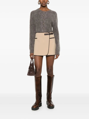 Close-up of the Sheridan Mini Skirt in Light Camel detailing the fabric composition and faux leather accents.