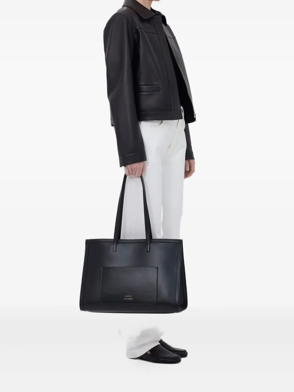 The Loulou de Saison Ascot Leather Jacket in Black, featuring a stylish spread collar and front welt pockets, perfect for embodying modern elegance in a black leather jacket.
