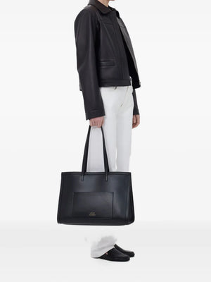 The Loulou de Saison Ascot Leather Jacket in Black, featuring a stylish spread collar and front welt pockets, perfect for embodying modern elegance in a black leather jacket.
