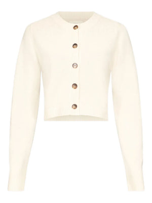 Zephir Cropped Cashmere Cardigan in Ivory showcasing the fitted silhouette and long sleeves that create an elegant look. Perfect example of a stylish cropped cashmere cardigan.