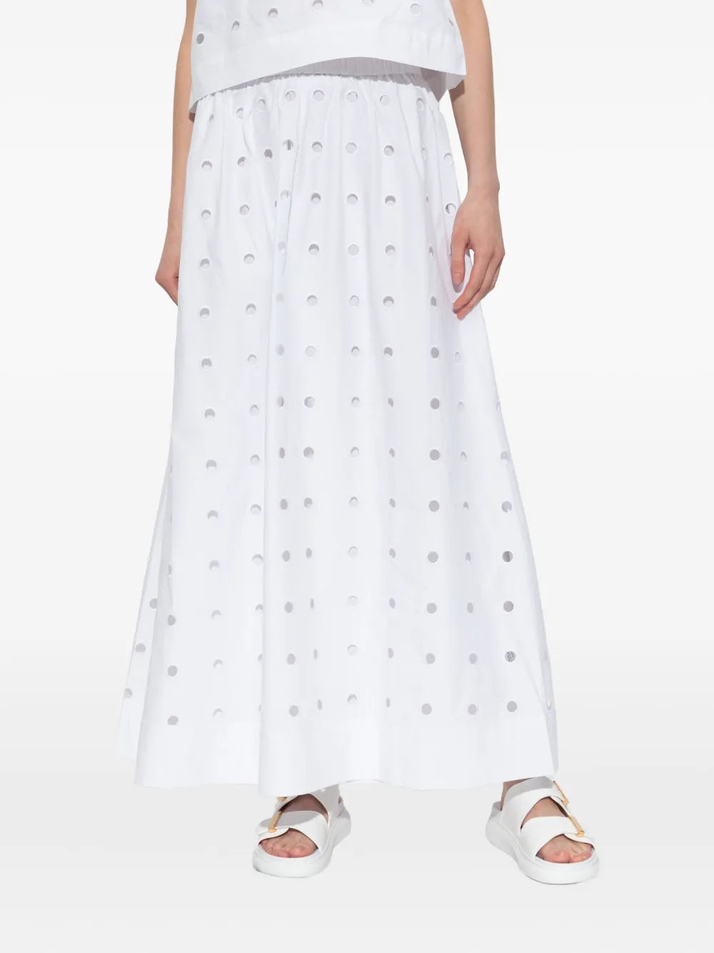 Model wearing the Peggy Skirt in Vintage White, a comfortable high-rise cotton laser cut skirt ideal for any occasion.