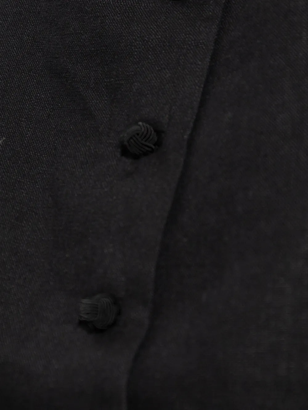 Detailed view of the soft linen texture of the Rio Top in Black, an essential black crop top.