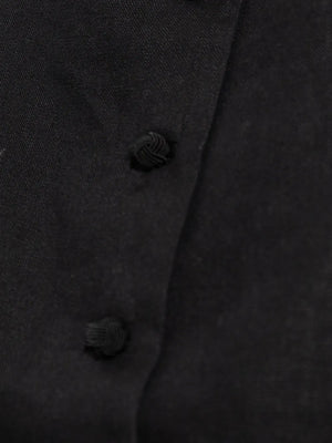 Detailed view of the soft linen texture of the Rio Top in Black, an essential black crop top.