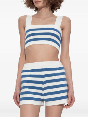 Chic Ari Crop Top in Blue Stripe paired with denim shorts, showcasing the versatility of this blue stripe crop top for easy summer styling.