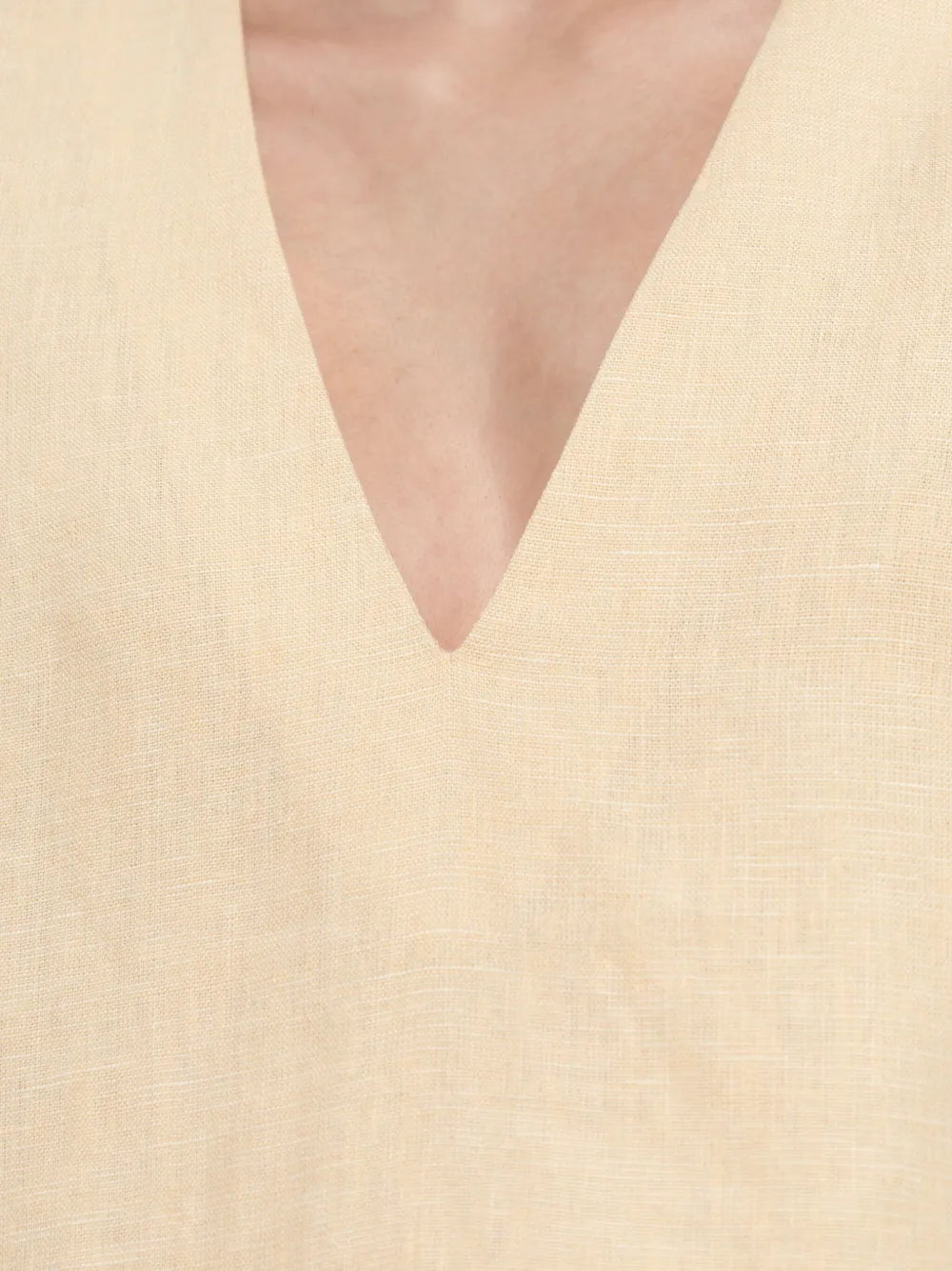 Flat lay of the Essie Kaftan in Dusty Citron, a chic mini kaftan dress made from 100% linen.