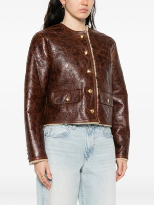 Back view of the Zanie Short Shearling Coat in Vintage Whiskey featuring the dropped shoulder design and flap pockets.