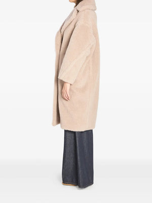 Detail of the luxurious fabric composition of the Max Mara Teddy Bear Icon Coat in beige.