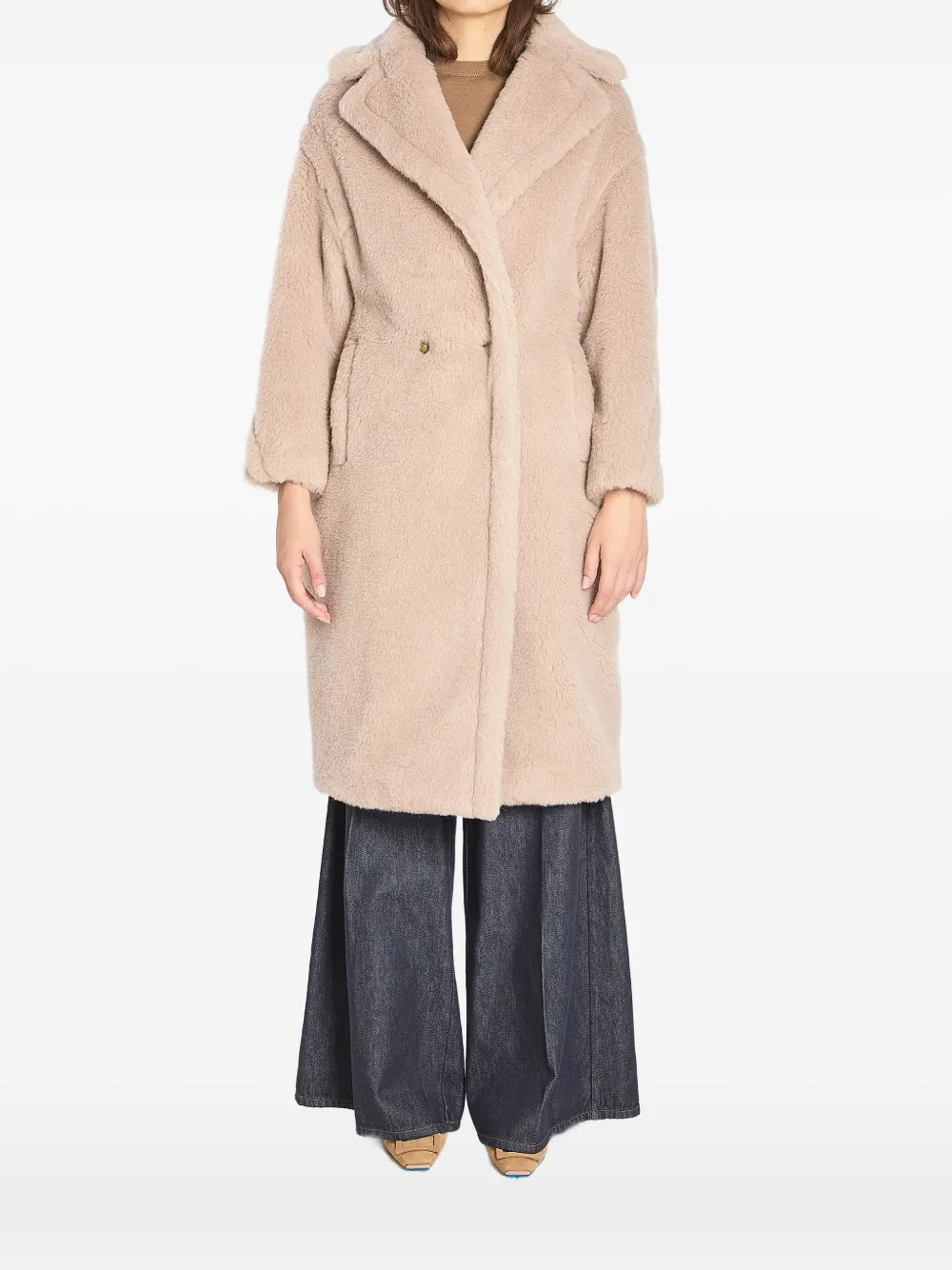 Close-up view of the plush texture of the Max Mara Teddy Bear Icon Coat in Beige.