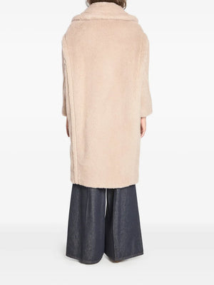 Back view of the Max Mara Teddy Bear Icon Coat in Beige showcasing its voluminous design.
