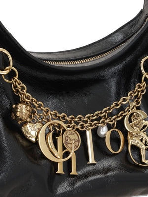 Styled shot of Chloé Charms Hobo Bag in Black, perfect for any fashionable outfit.