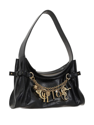 Close-up of Chloé Charms Hobo Bag in Black highlighting the dangling pendants and signature Chloé letters.