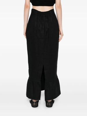 Back view of the Matilda Column Skirt in Black, emphasizing the flowing frilled hem and premium linen fabric.