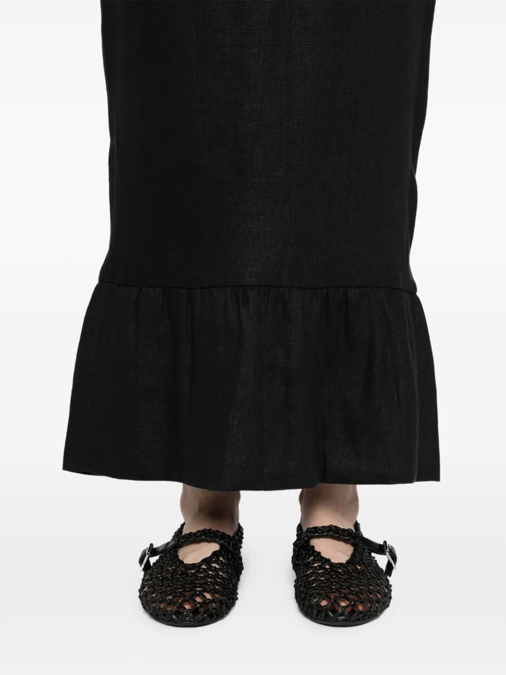 Flat lay of the Matilda Column Skirt in Black, showcasing its design details and texture, perfect for any stylish wardrobe.