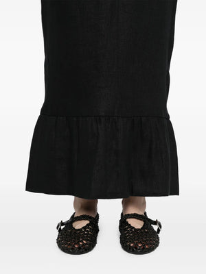 Flat lay of the Matilda Column Skirt in Black, showcasing its design details and texture, perfect for any stylish wardrobe.
