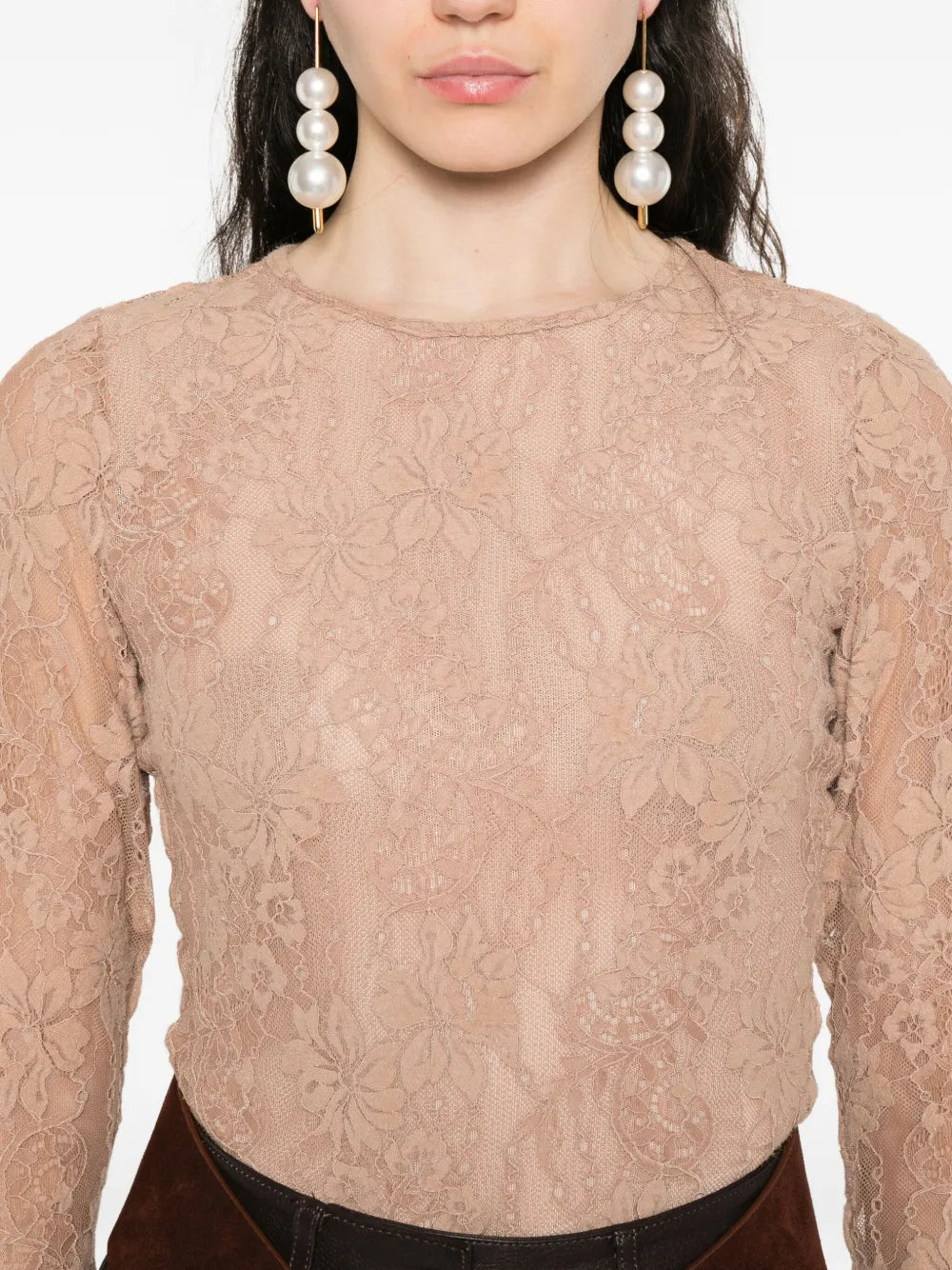 Full body shot of a woman in the Lace Bodysuit in Biscuit from Zimmermann, styled for a chic look.
