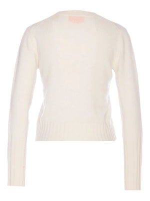 Detailed shot of the ribbed hem and cuffs on Shrunken Crew in Cream, made from high-quality cashmere.