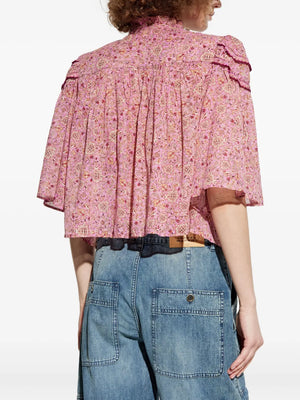 Back view of the Carmen Top in Pink highlighting its buttoned front detail.