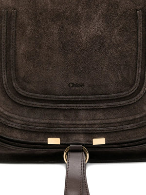 Marcie Double Carry Bag in Kohl Brown, elegantly displayed, showing the hand-wrapped double handles and dangling leather tassels.