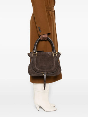 Marcie Double Carry Bag in Kohl Brown displayed with accessories, highlighting its slouchy shape and stylish design.