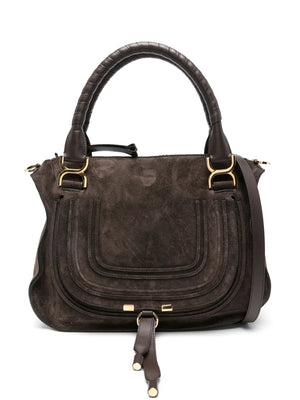 Close-up of the Marcie Double Carry Bag in Kohl Brown showcasing its suede calfskin texture and feminine silhouette.
