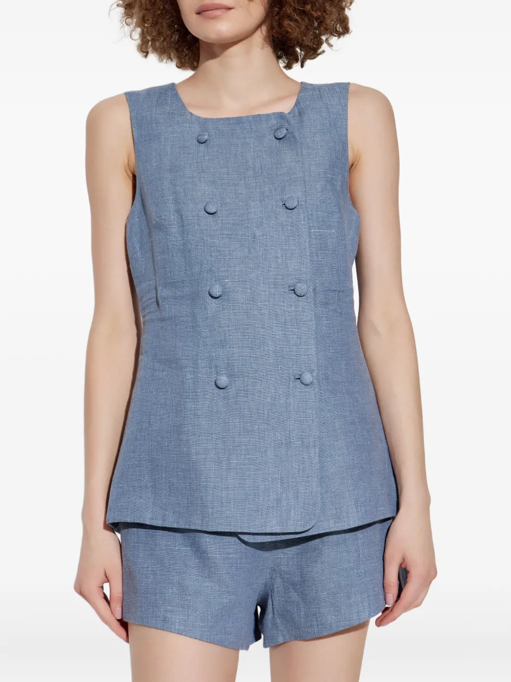 Close-up of Thea Vest in Steel Blue detail, emphasizing the fine linen texture and stylish features.