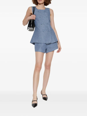 Back view of Thea Vest in Steel Blue with adjustable buckle fastening, highlighting its chic design.