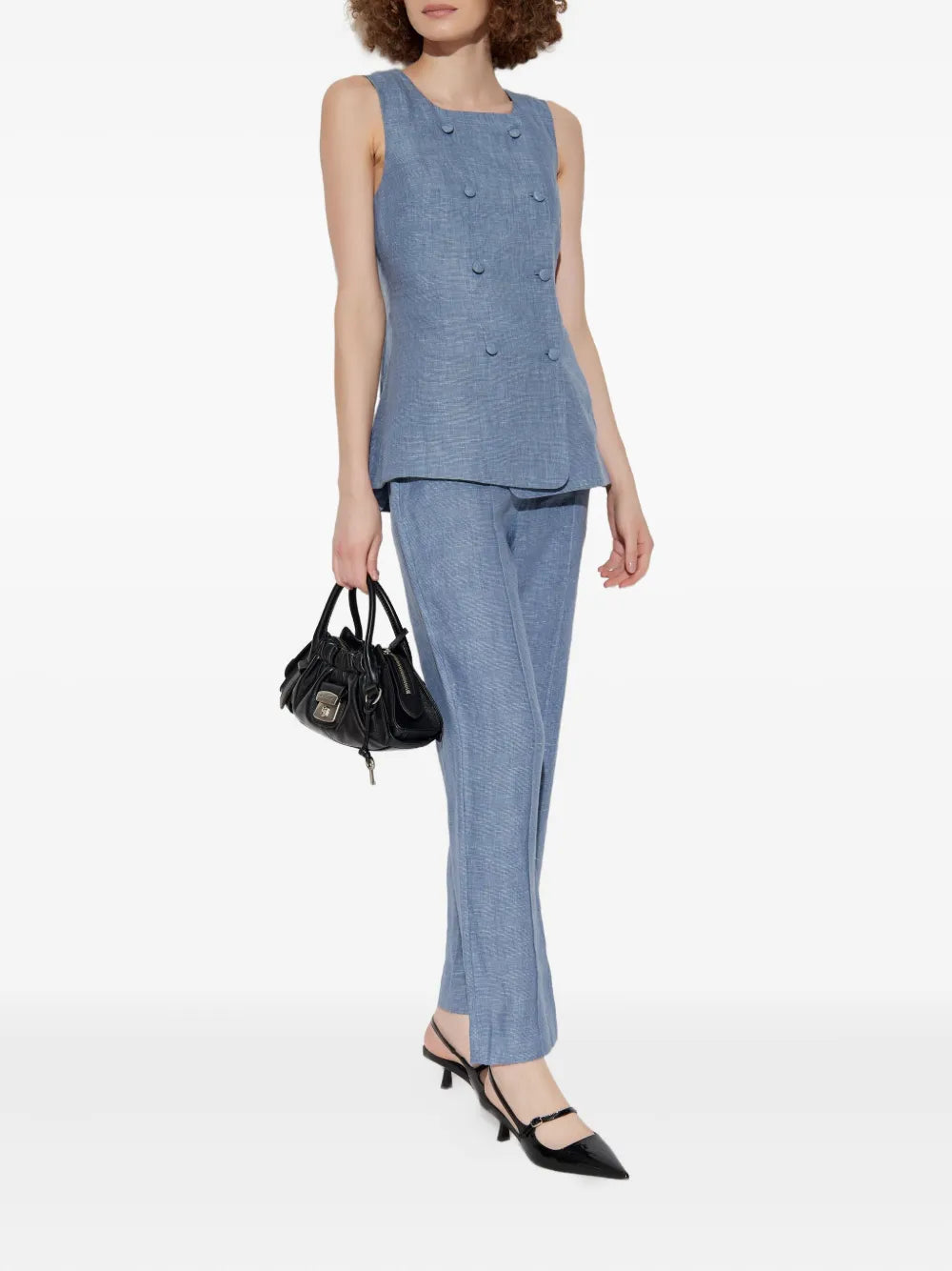 Close-up view of Thea Trousers in Steel Blue, highlighting the sleek straight leg cut and luxurious linen texture.
