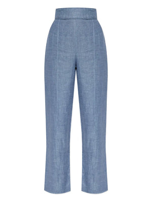 Thea Trousers in Steel Blue styled with a matching vest, showcasing the premium linen fabric and tailored high-rise design.