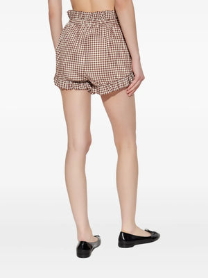 Close-up of fabric texture on Callie Shorts in Petite Mocha Gingham, made from 100% hand-loomed cotton.