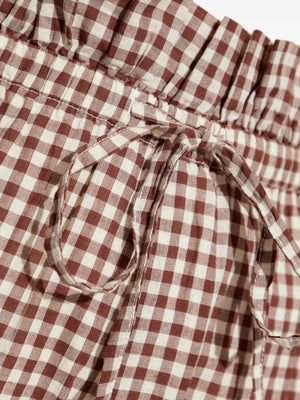 Model wearing Callie Shorts in Petite Mocha Gingham paired with matching Callie Blouse, demonstrating versatile styling options.
