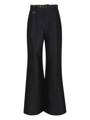 Model walking in the Hypnotic Flare Pant in Black, capturing the flowy movement and elegance of the garment.